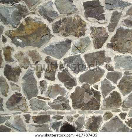 Stone texture made of different stones. Realistic texture photo