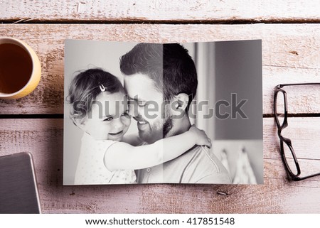 Fathers day composition. Picture of father holding his daughter