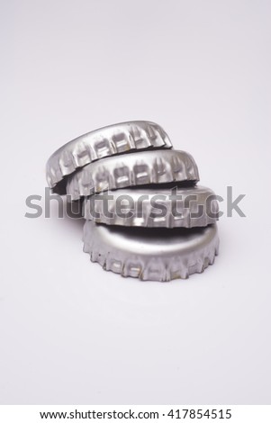 Silver bottle caps isolated on white background