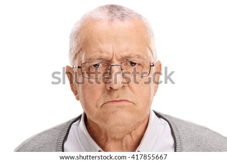 Portrait of an angry senior frowning and looking at the camera isolated on white background Royalty-Free Stock Photo #417855667