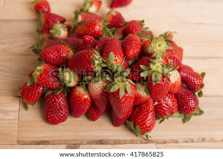 Strawberries on a wooden table, studio picture