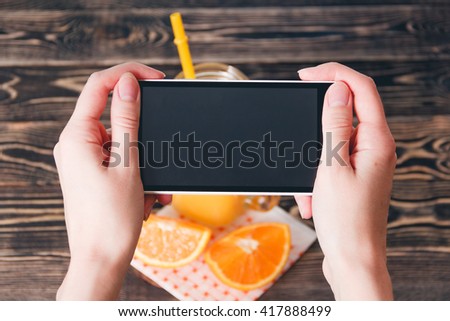 Hands Taking Photo of Oranges. Technology Concept
