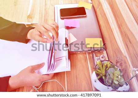 Office table with notepad and computer