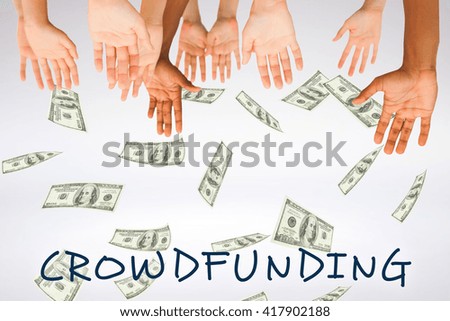 Hands raising in the air against grey background