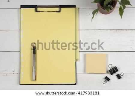 Business blank, notepad  and pen at office desk table top view. Corporate stationery branding mock-up
