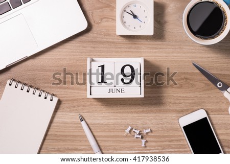 Happy father's day. Top view Greetings card of desk with laptop, tie, coffee cup, notebook, pen, calendar and smartphone on wooden backround.