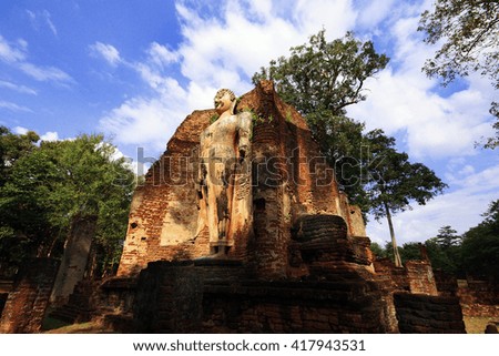 Standing buddha statue in old Buddhist temple ruins, Kamphaengphet City, Thailand