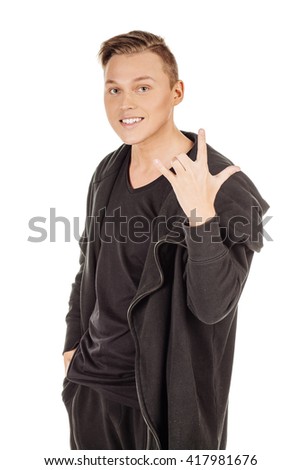 young man doing a rock gesture