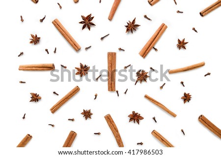Set of cinnamon, clove and star anise, scattered in a chaotic manner, isolated on white background Royalty-Free Stock Photo #417986503