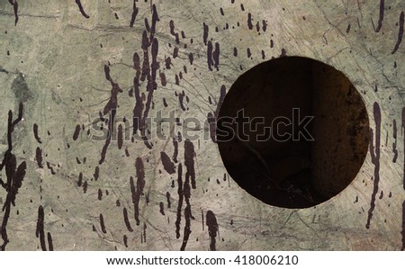 Dark circle against concrete wall with dark paint drippings Royalty-Free Stock Photo #418006210