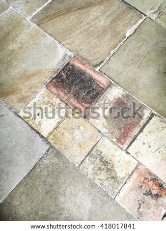 Worn stone tiles on a floor