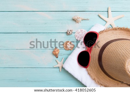 beach accessories on wooden board pastels