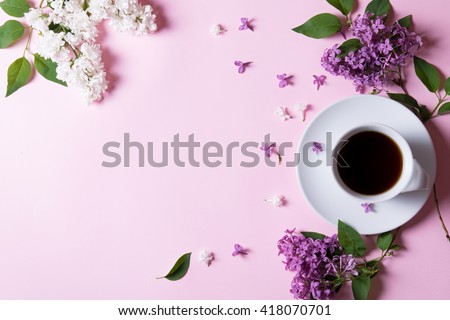 Good morning black coffee surrounded with lilac, empty space