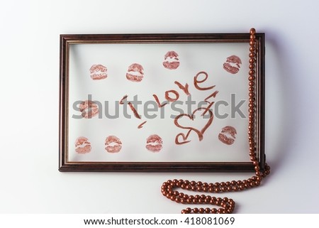 Kissing or traces of lipstick in a frame