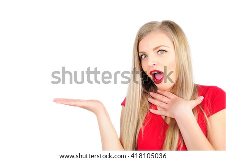 Surprised young blond woman holding something on the palm