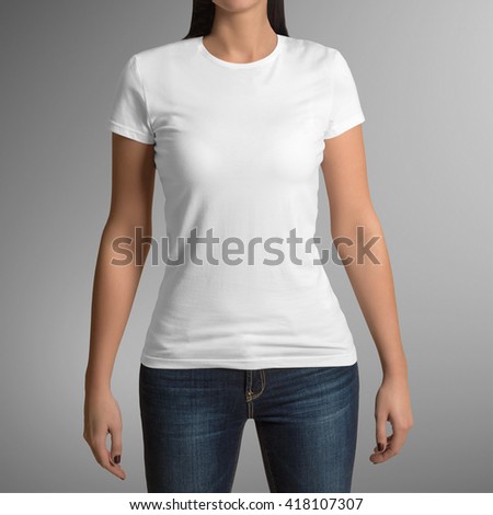 Female wearing white t-shirt isolated on gray background, with clipping path to change background Royalty-Free Stock Photo #418107307