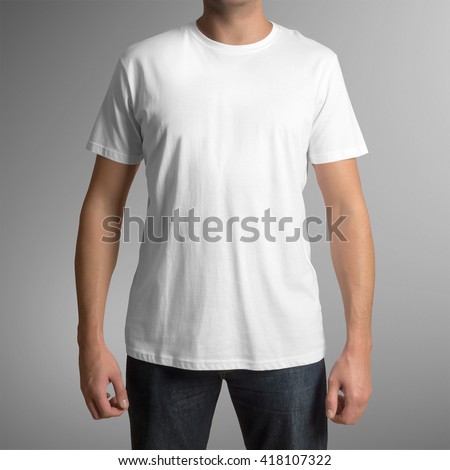 Man wearing white t-shirt isolated on gray background, with clipping path to change background Royalty-Free Stock Photo #418107322
