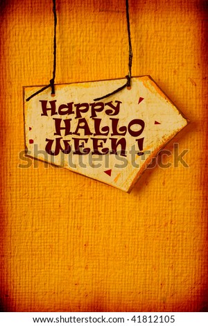 Close up of handmade paper tag with HALLOWEEN