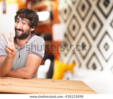 crazy young man with table .happy expression