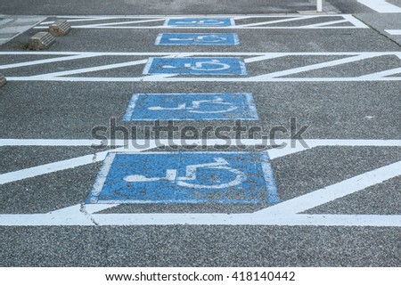 row of parking for people with disabilities- parking for people with disabilities sign