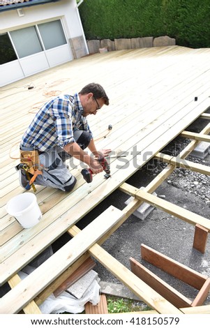 Carpenter building wooden deck 