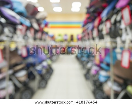 Blurred of kids strollers store background with bokhe