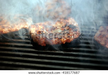 picture of a burger on a grill                     