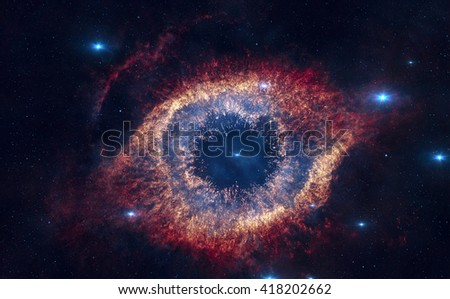 The Helix Nebula is a large planetary nebula located in the constellation Aquarius. Elements of this image furnished by NASA. Royalty-Free Stock Photo #418202662