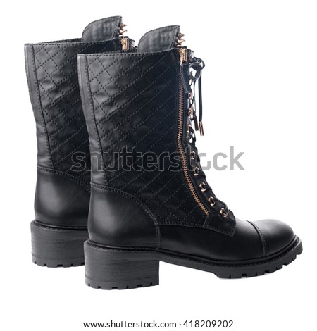 Black biker high boots isolated on white background.
