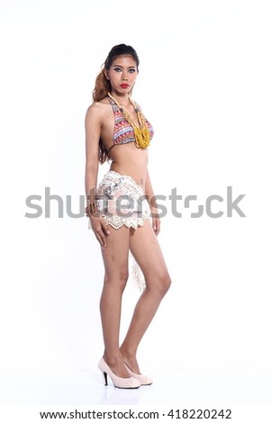 Beautiful Asian Thai Model Female Tan Skin in Grey Sport Swim Suit Fashion Make Up on White Background in Studio Lighting, isolated, fashion post stand full body