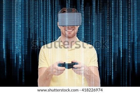 3d technology, virtual reality, programming, entertainment and people concept - happy young man with virtual reality headset playing with game controller gamepad over binary code and black background