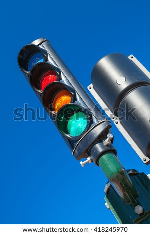 Traffic light with additional blue bicycle section shows green allowed signal