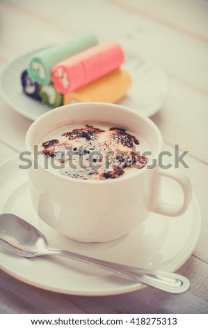 A cup of cafe latte and cake