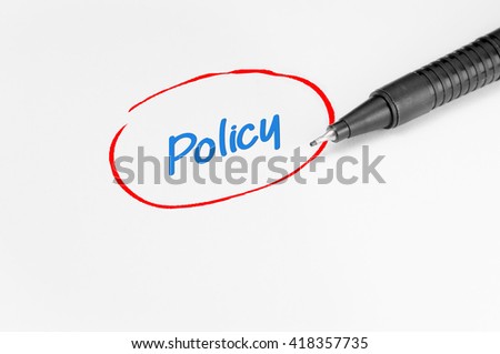 Policy text written on white paper - Business Concept