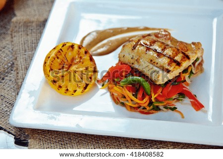 Baked perch fillet with rosemary and lemon with blanched vegetables