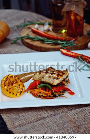 Baked perch fillet with rosemary and lemon with blanched vegetables
