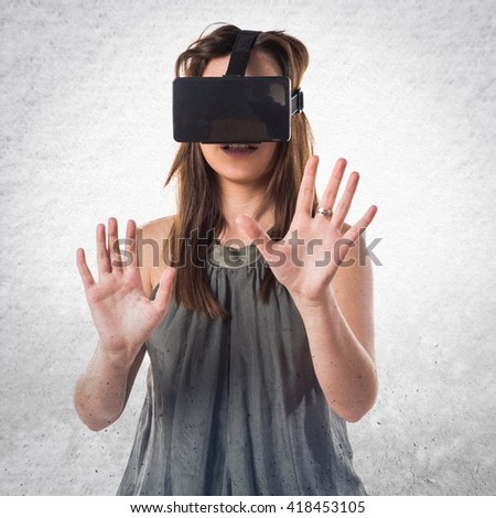 Young girl using VR glasses