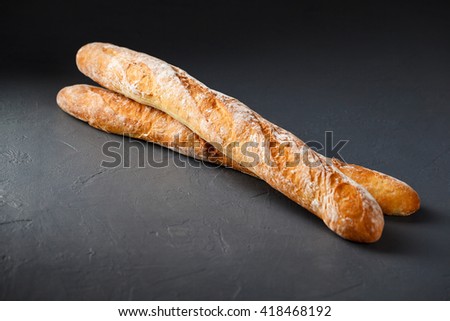 A pair of french bread baguette isolated on gray background.
