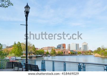 Wilmington Delaware skyline and waterfront along the Christiana River Royalty-Free Stock Photo #418469029