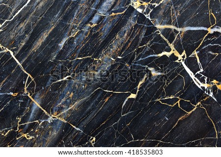 Gold yellow patterned natural of dark gray marble for texture and design Royalty-Free Stock Photo #418535803