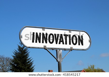innovation - white metal sign on blue sky background