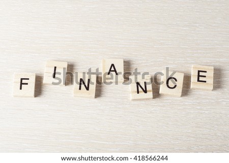 Wooden Blocks with the text: Finance. Wood ABC
