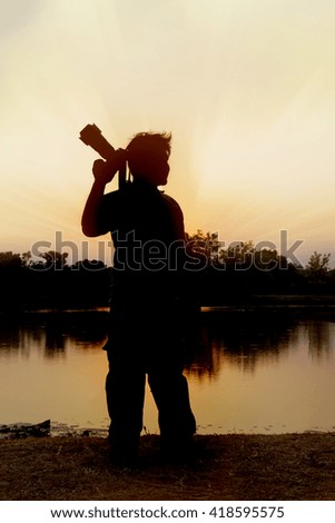 Photographer silhouette with sunset.