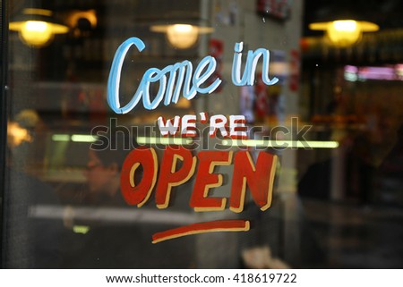 Welcome open sign in a door of a shop