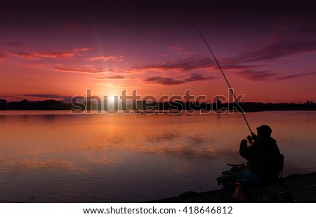 fantastic landscape, multicolor sky over the lake. majestic sunrise. Fishing feeder at sunset. Fisherman silhouette at sunset. use as background. series with many color variations. creative images.