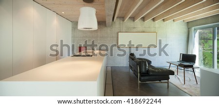 Interior of a modern chalet in cement, counter top of kitchen