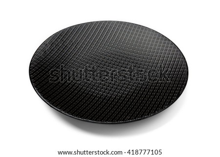 Elevated view of a black textured plate isolated on white background.
