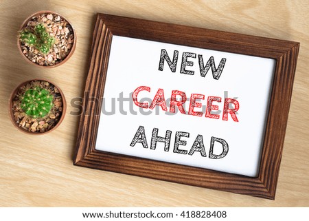 New career ahead, text message on wood frame board on wood table / business concept / Top view