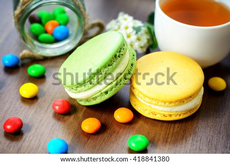 Tea and macaroons on a wooden table