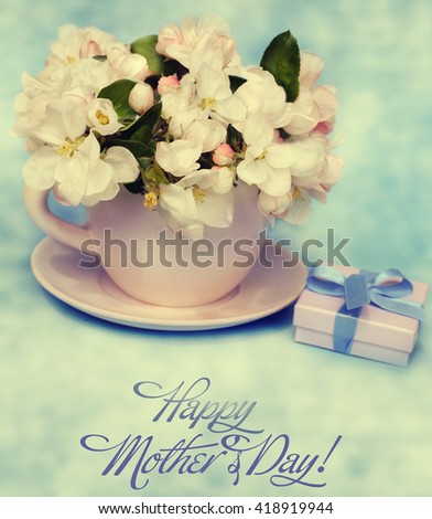 Apple blossom flowers in vase with gift box